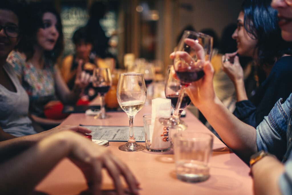 Photo by Helena Lopes: https://www.pexels.com/photo/people-drinking-liquor-and-talking-on-dining-table-close-up-photo-696218/