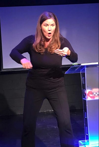 Kirsten Laurel Prather Caplan in character as one of the expert panelists