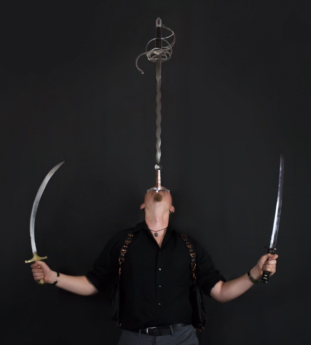 Impalement artist Cyrus Pynn’s show Down the Hatch: Tale of a Sword Swallower is at Whitefire Theatre as part of their tremendous Solofest series on Friday, January 13th.