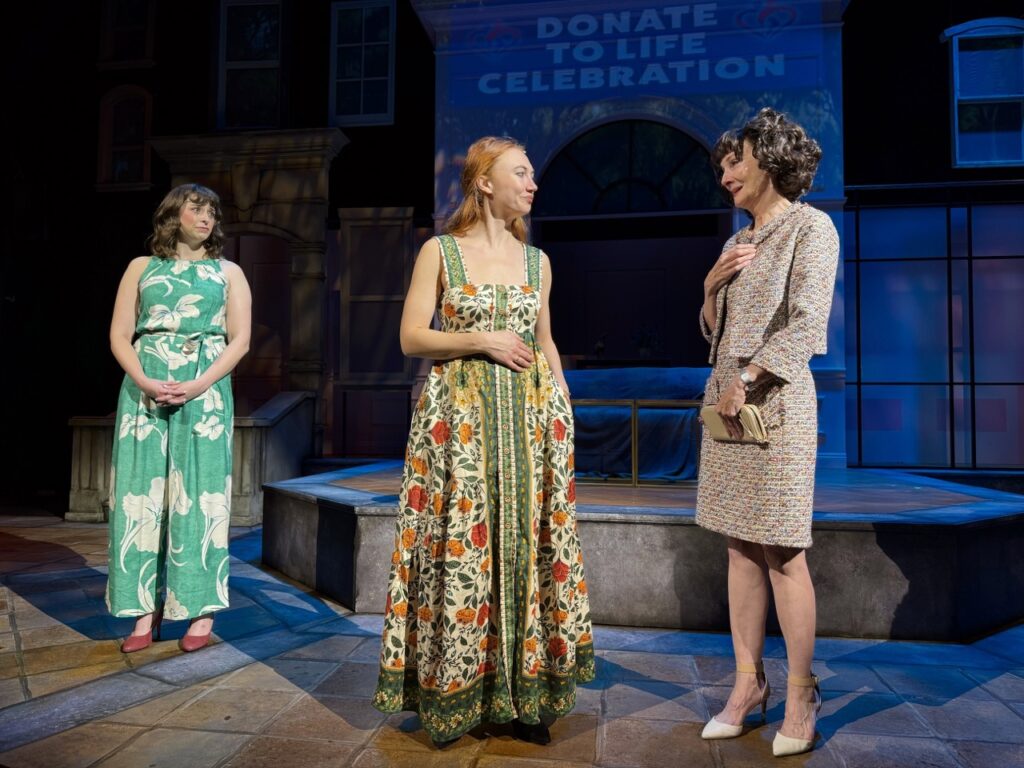 Three women in a dramatic moment onstage during I’ll Give You My Heart at the Colony Theatre.