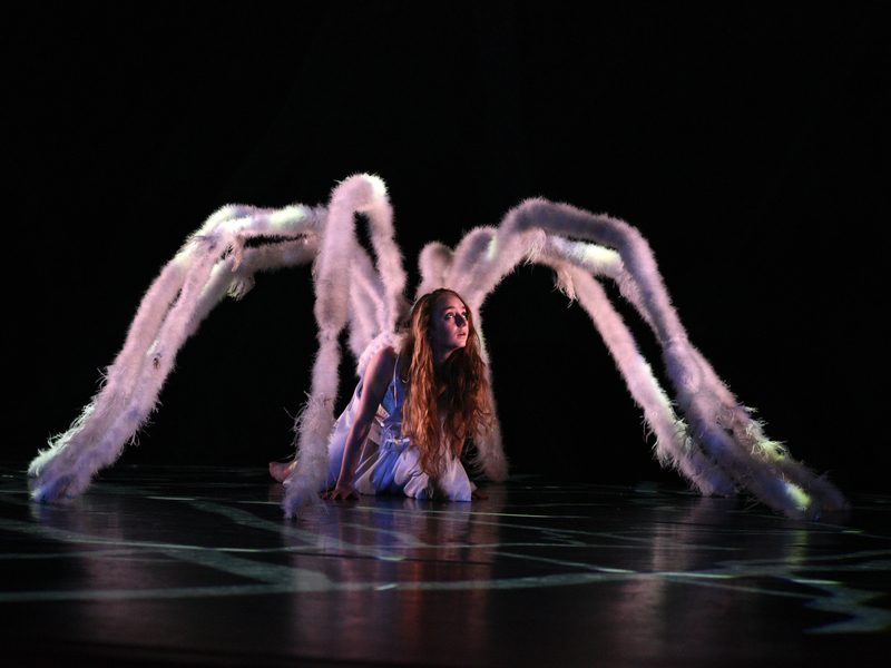 MOMIX Alice spider scene with dancer and illuminated prop tentacles at The Soraya