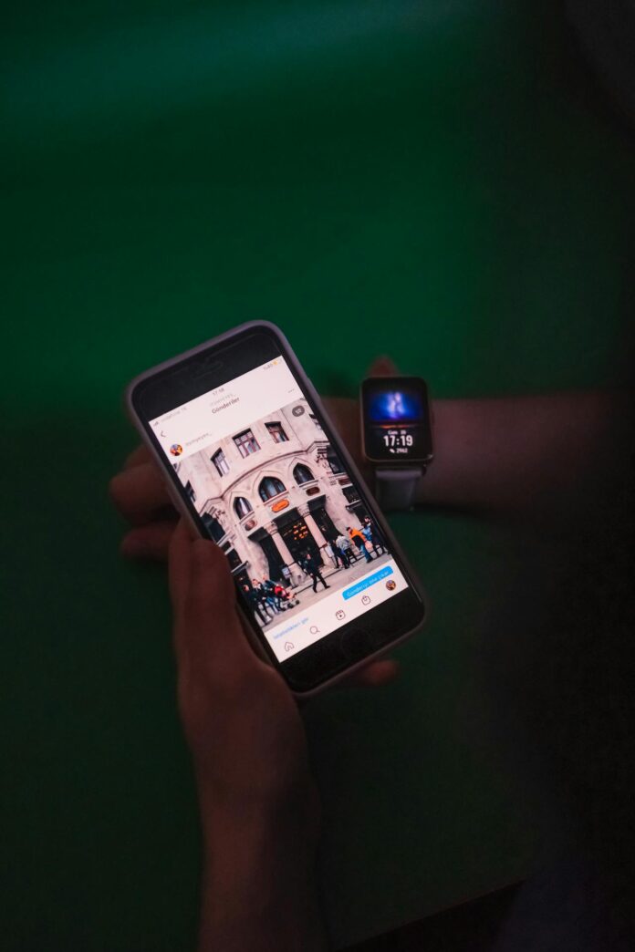 hands holding a smartphone while checking notifications