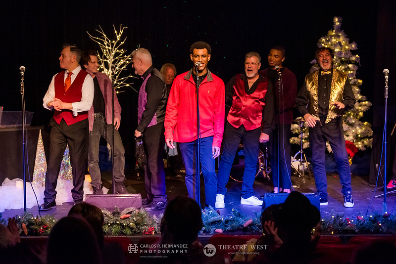 Male vocalist leads ensemble during A Sleighful of Songs at Theatre West