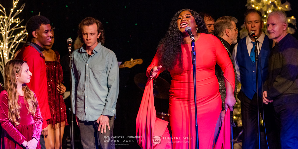 Lead vocalist performs holiday song during A Sleighful of Songs at Theatre West