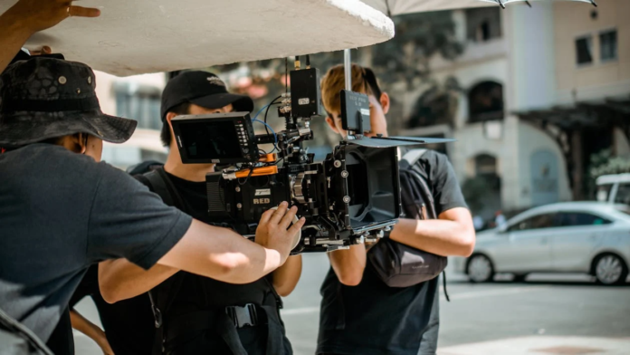 Professional video production company filming with cinema camera on location