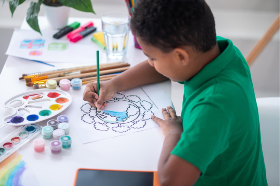 Person coloring a drawing indoors with pencils, focused on a calm creative activity.