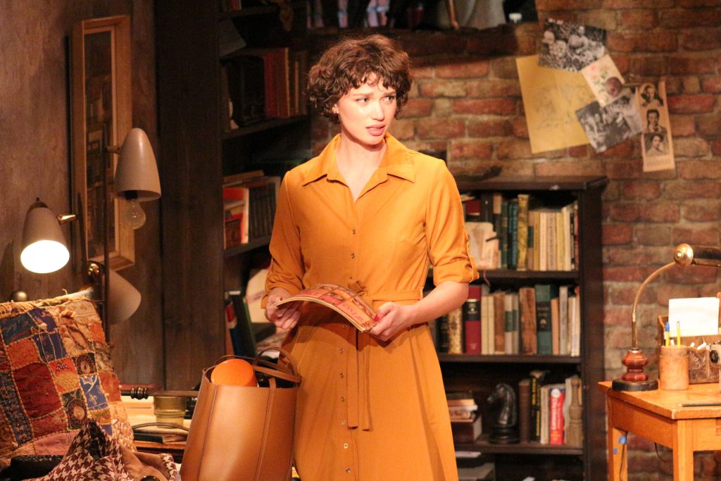 Evangeline Edwards as the typist in a quiet moment onstage