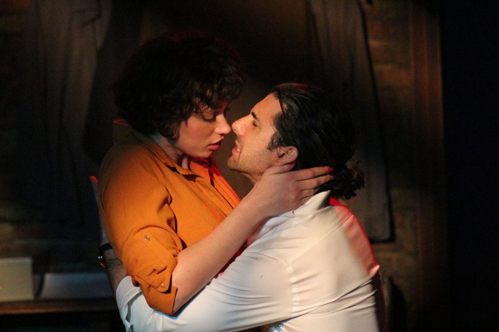 Actors in a tense, intimate moment in The Typist play