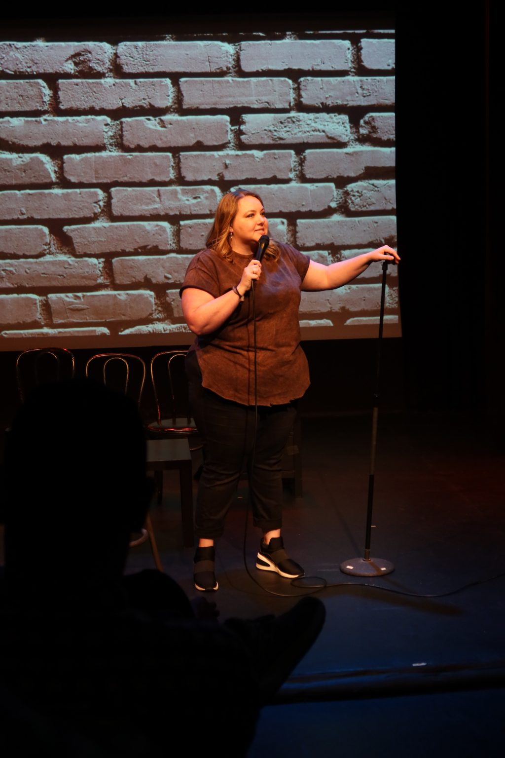 Marissa Fennell performing stand-up in It’s All a Joke at Whitefire Theatre