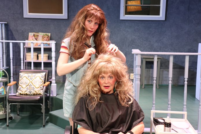 Steel Magnolias scene with stylist adjusting hair in salon chair