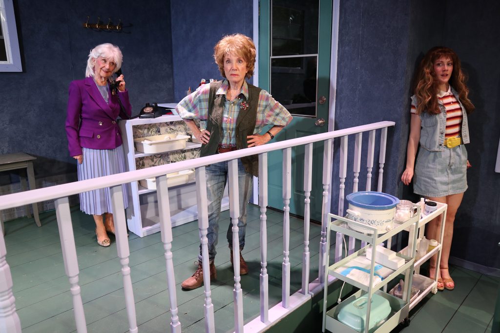 Steel Magnolias cast on salon set with staircase and styling station