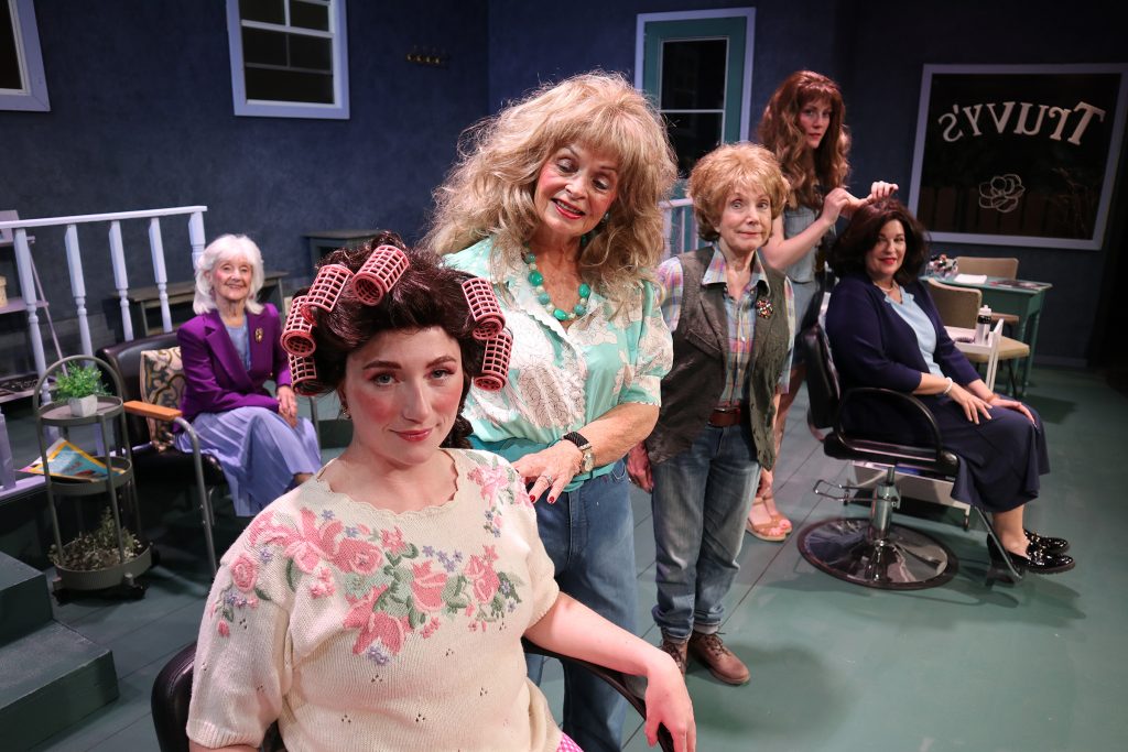 Steel Magnolias salon scene with Shelby seated and friends around her
