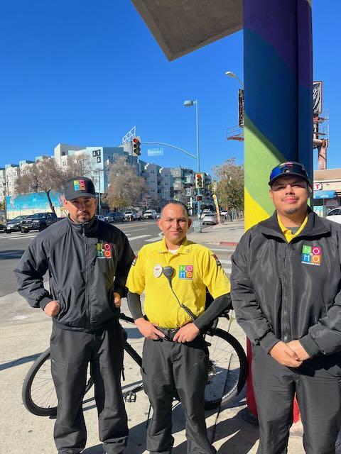 NoHo BID safety ambassador team standing in the North Hollywood Arts District near the Metro station.
