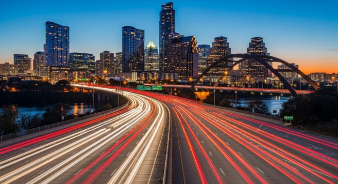 Austin Texas skyline and highway traffic at night