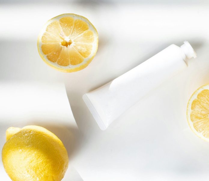 Wellness products with lemon and skincare bottle representing creativity and well-being routines for artists.