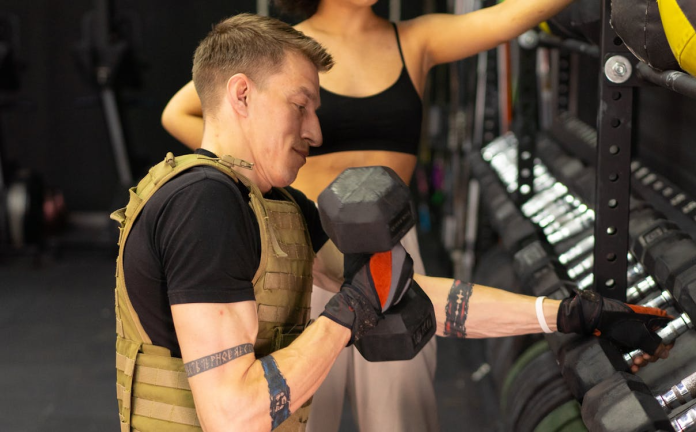 image weighted vest workout with person lifting dumbbells in gym strength training