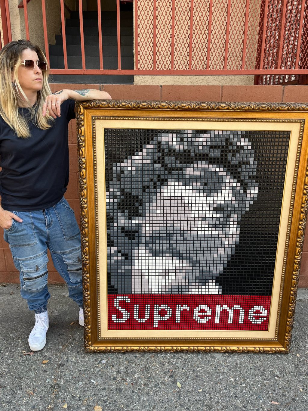 Supreme David. Close-up of 8-bit style resin tile artwork showing hand-painted square tiles forming a portrait inside an ornate gold frame