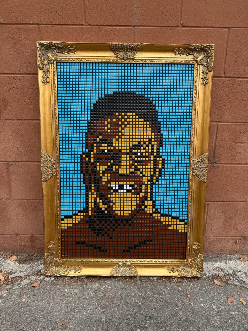 Mike Tyson. Colorful 8-bit resin tile portrait artwork in a gold frame featuring a stylized character against a blue background