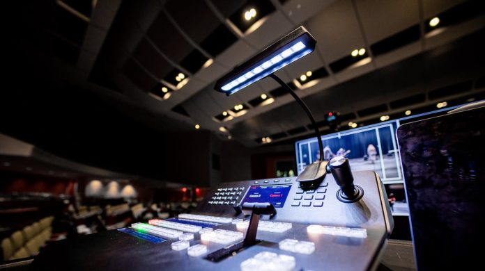 theater control board with stage and lighting setup immersive theater technology production