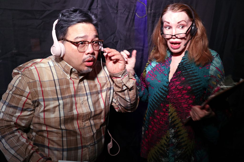 Two performers react with surprise backstage in a chaotic scene from The Young and the Rest of Us.