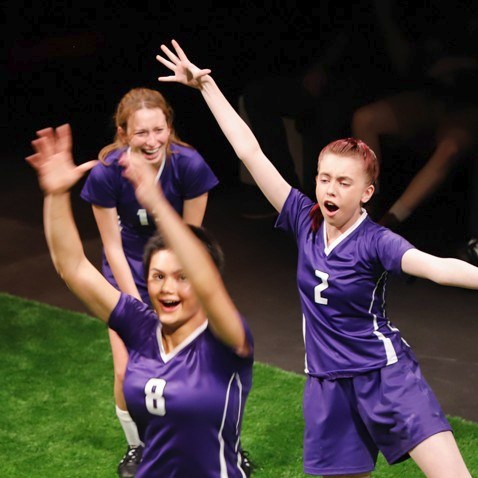 The Wolves production at Pierce College Theatre with players celebrating on indoor soccer field