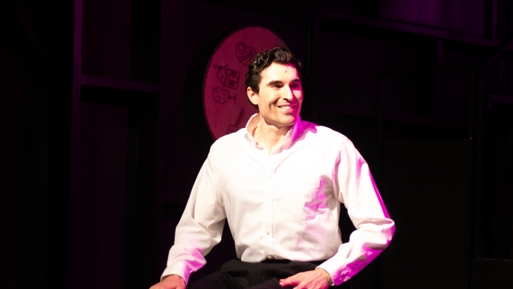 The Last Five Years performance at Hudson Theatre featuring male lead during upbeat scene