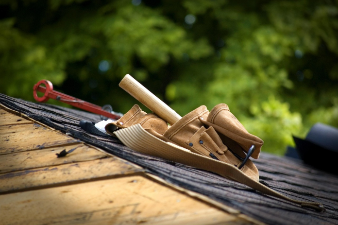 Roofing tools and materials on a residential roof during installation or repair work