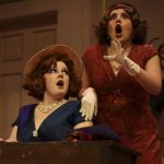 Actors in vintage costumes react dramatically during a comedic misunderstanding scene in LAPC Theatre’s A Flea in Her Ear