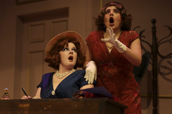 Actors in vintage costumes react dramatically during a comedic misunderstanding scene in LAPC Theatre’s A Flea in Her Ear
