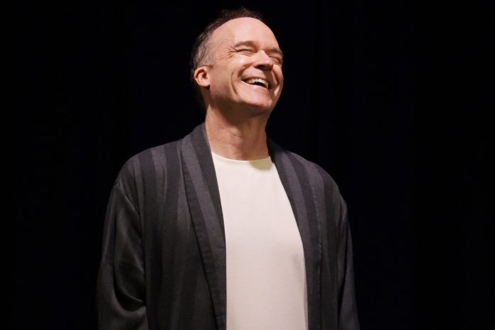 260530_182619 Stefan Marks smiles onstage during My One Woman Show (The Search for a Truthful Moment) at the 2026 Hollywood Fringe Festival.