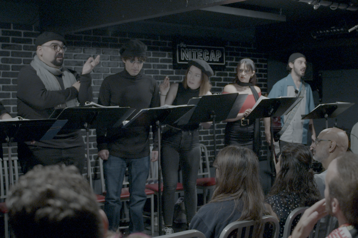 Cast members perform a scene from Bucket of Blood: The Horror Comedy Cabaret during the developmental reading at the Nitecap in Burbank.