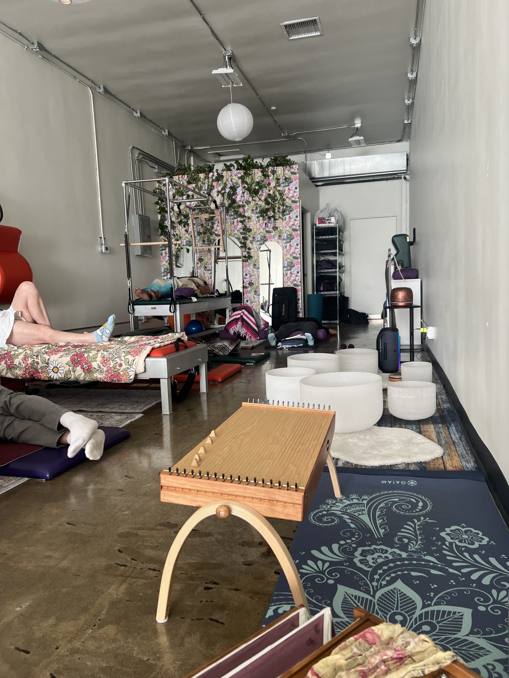 Crystal singing bowls, yoga mats and reformers are set up for a sound healing session at Swan Movement Arts in the NoHo Arts Distric