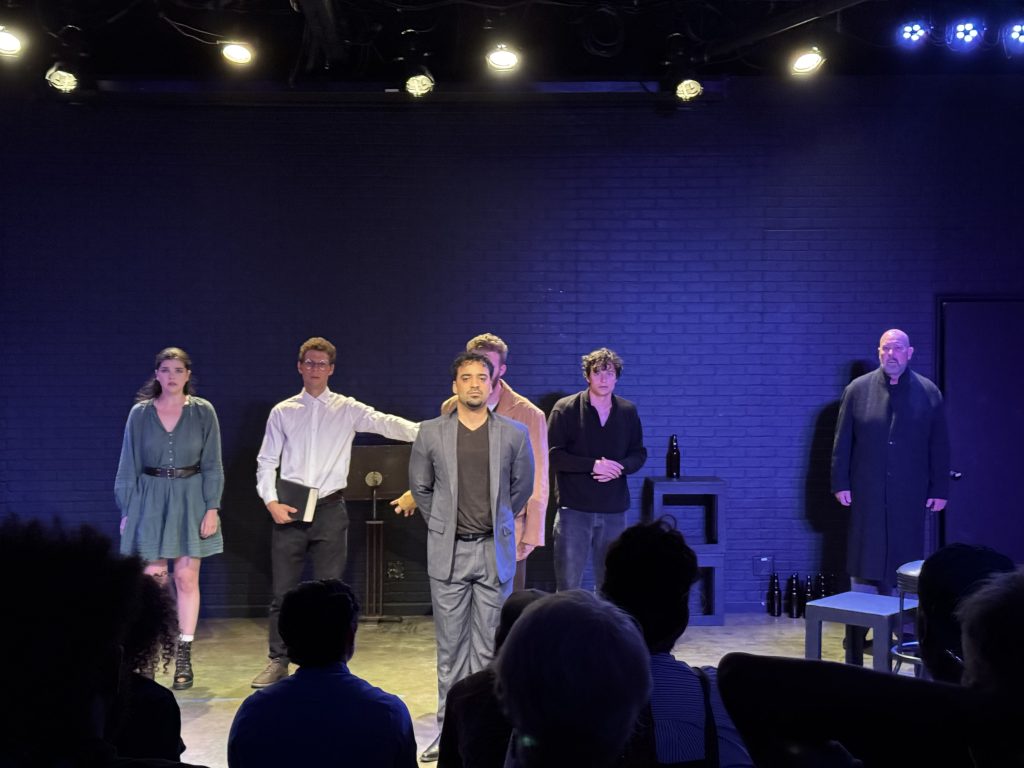 Characters confront one another during a pivotal scene in We Are All Burning at the 2026 Hollywood Fringe Festival.