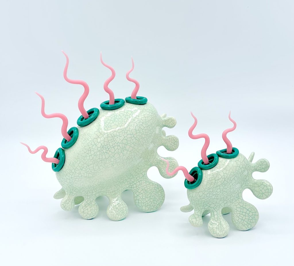 Squiggle Puffs by Josh Bass, whimsical mixed media sculptures with pale mint forms, teal accents and pink curling elements inspired by organic shapes.