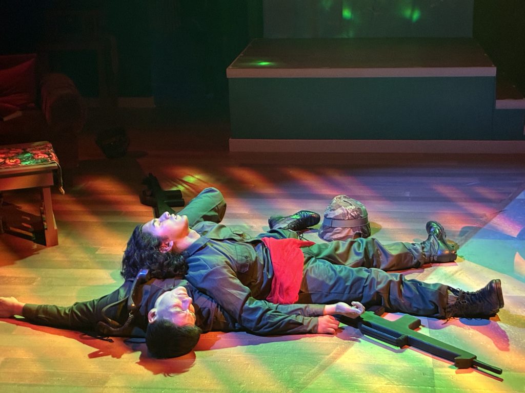 Luie Flores and a fellow soldier lie wounded on a Vietnam battlefield in Soul Sacrifice at CASA 0101 Theatre.