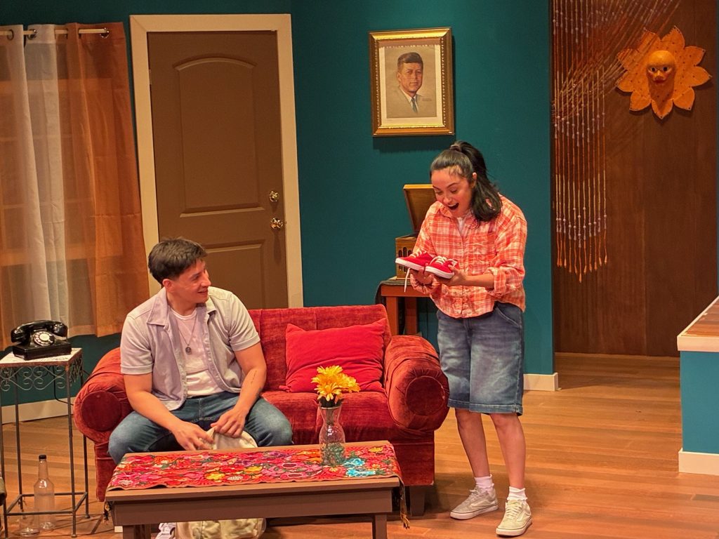 Luie Flores shares a joyful family moment with his sister in Soul Sacrifice at CASA 0101 Theatre.