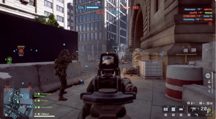 image Battlefield 6 Conquest gameplay showing a squad attacking a contested objective in an urban combat zone.