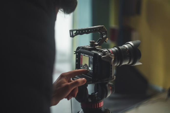 Why Your Videos Look Amateur: beginner filmmaker using a professional video camera to improve video quality.