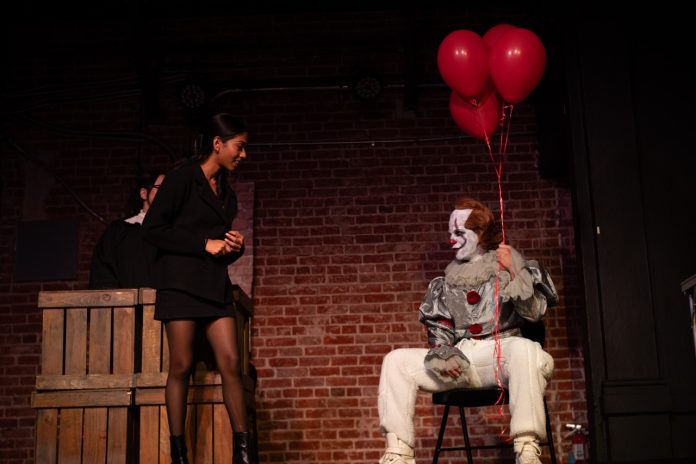 Pennywise appears as a witness with red balloons in Case Closed??, the absurdist courtroom comedy at the Hollywood Fringe Festival.
