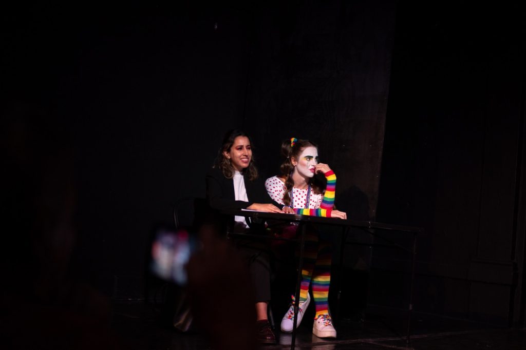 Defense attorney questions a colorful clown witness in Case Closed??, the Hollywood Fringe courtroom comedy.