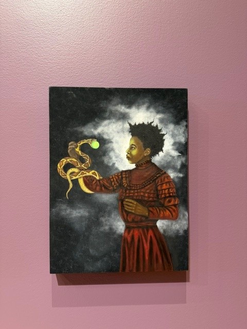 Painting of a child holding a glowing snake in A Queer Arcana: Art, Magic, and Spirit.