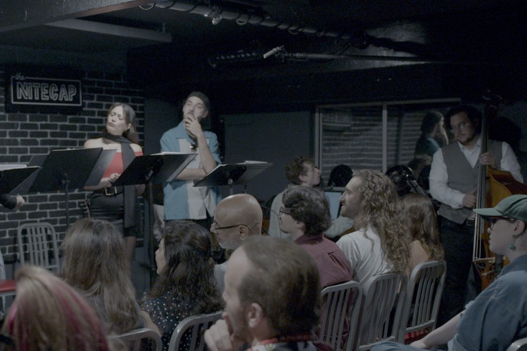 Kris Bramson and Trevor Alkazian perform alongside musicians Ethan Furman on keys and Vincenzo De La Rosa on bass during Bucket of Blood: The Horror Comedy Cabaret.