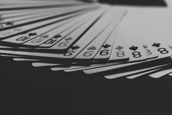 image Playing cards symbolize the entertainment and excitement of modern sweepstakes casinos and social casino games.