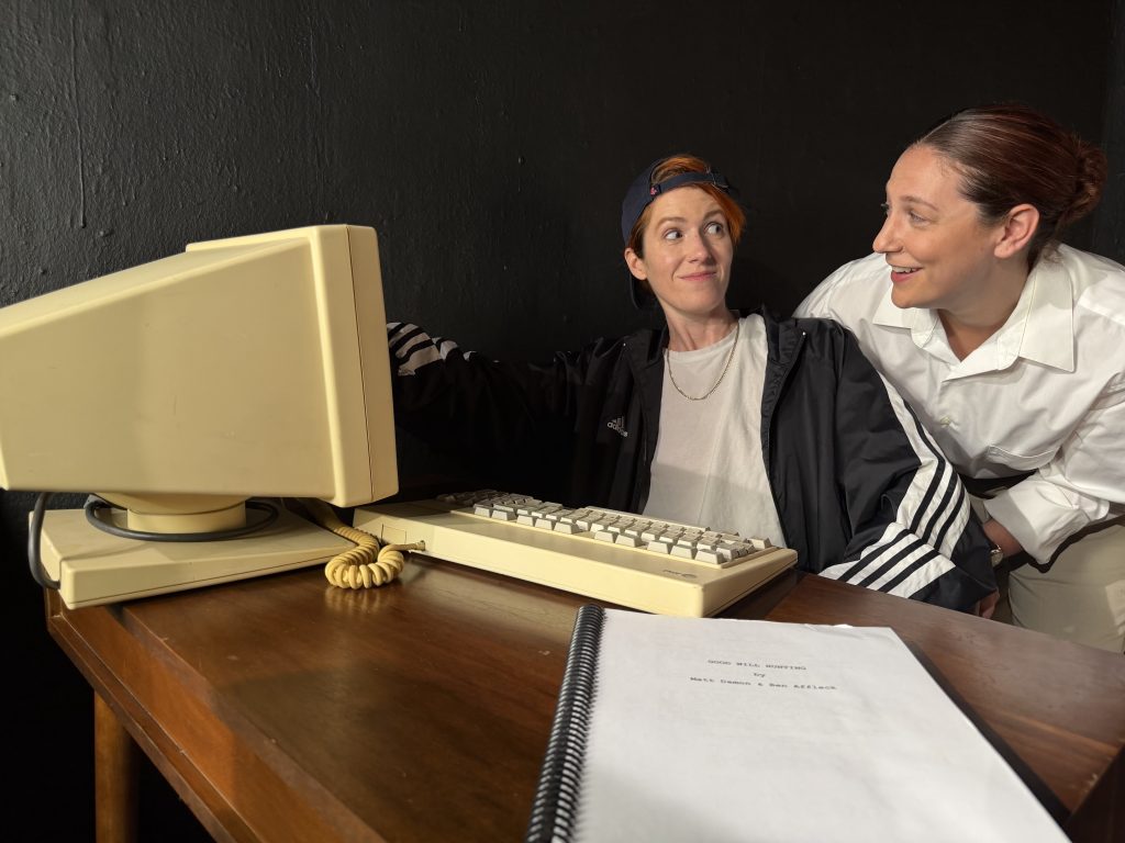 Genevieve Lerner and Spring Ferrara react with amazement while reading the mysteriously delivered Good Will Hunting screenplay in Matt & Ben at The Sherry Theater.