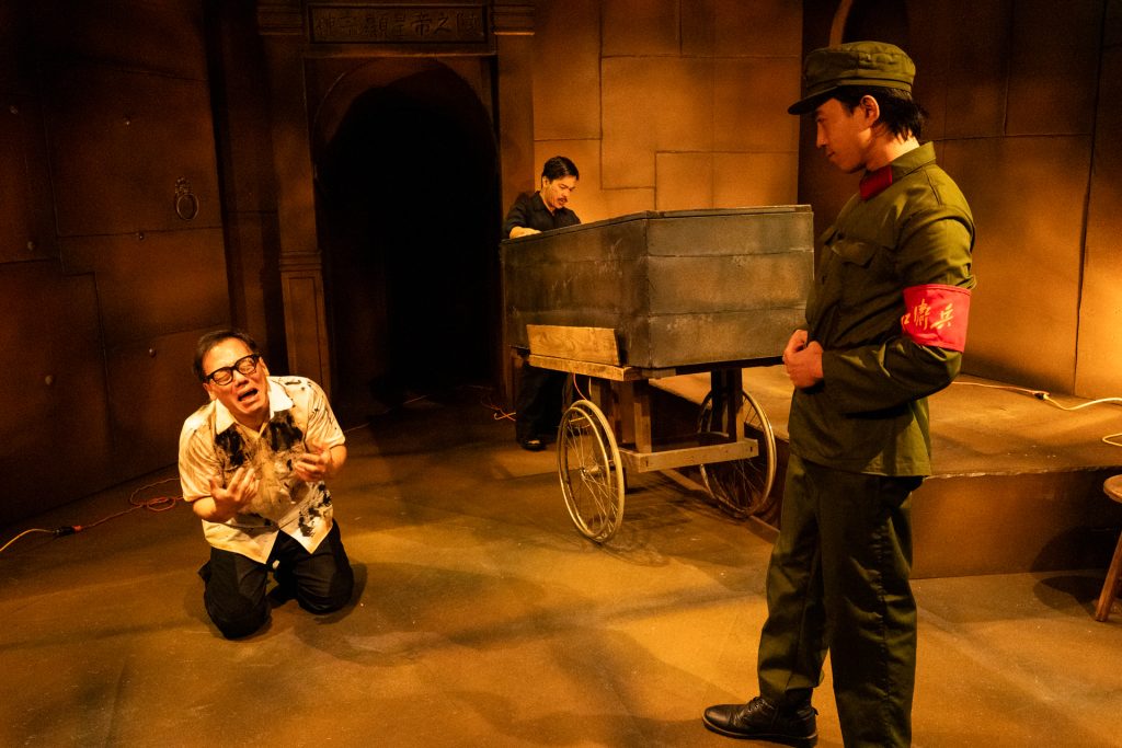 Alt text: Cultural Revolution scene from In the Tomb of Ten Thousand Calendars featuring Red Guards inside the emperor’s tomb.