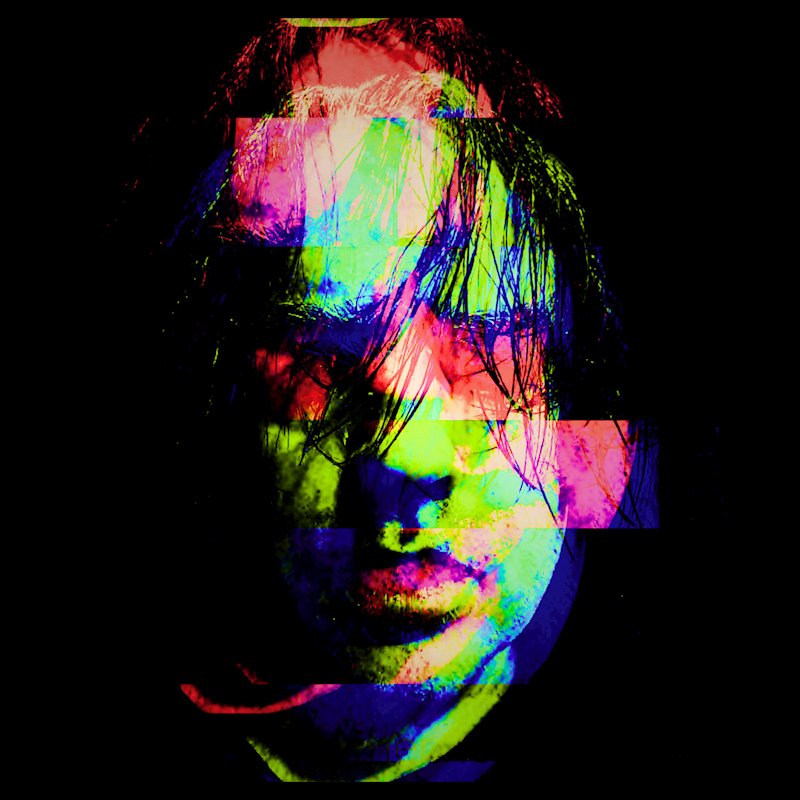 Glitch-style portrait of Stephen James Moore with vivid red, green and blue digital distortion.