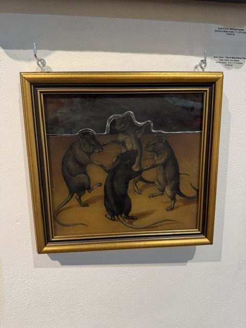 Framed artwork depicting four rats gathered together against a dark brown background at Laluzapalooza 2026.