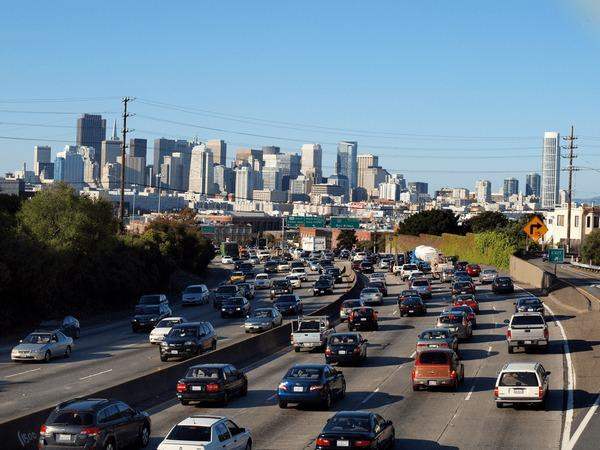 image Heavy traffic on a Los Angeles freeway with the downtown skyline in the distance, illustrating busy and potentially dangerous California highways.