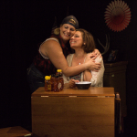 Two women embrace during a scene from Exit, Pursued by a Bear at RD Studio Theatre in North Hollywood.
