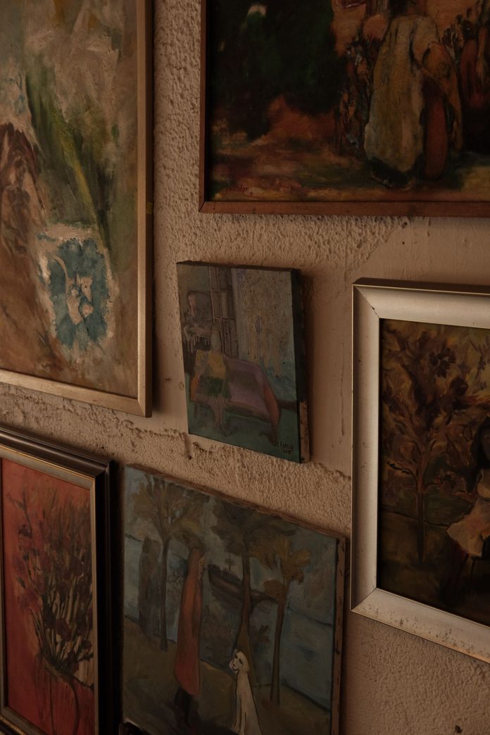 Framed landscape artwork displayed in a traditional interior, highlighting the importance of art appraisal and collection documentation.